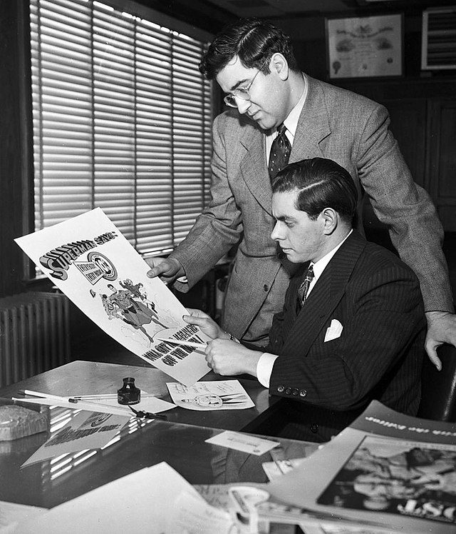 Joe Shuster (seated) and Jerry Siegel at work on Superman in their studio in 1942
