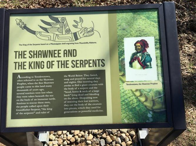 An interpretive sign at Serpent Mound shares the story of the Shawnee and the King of the Serpents.