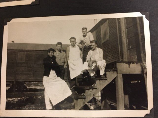 Men outside a cabin