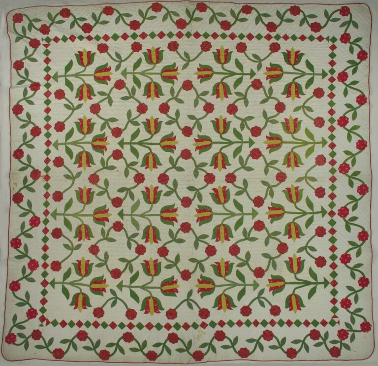 Red and green applique quilt in the Dutch Tulips pattern