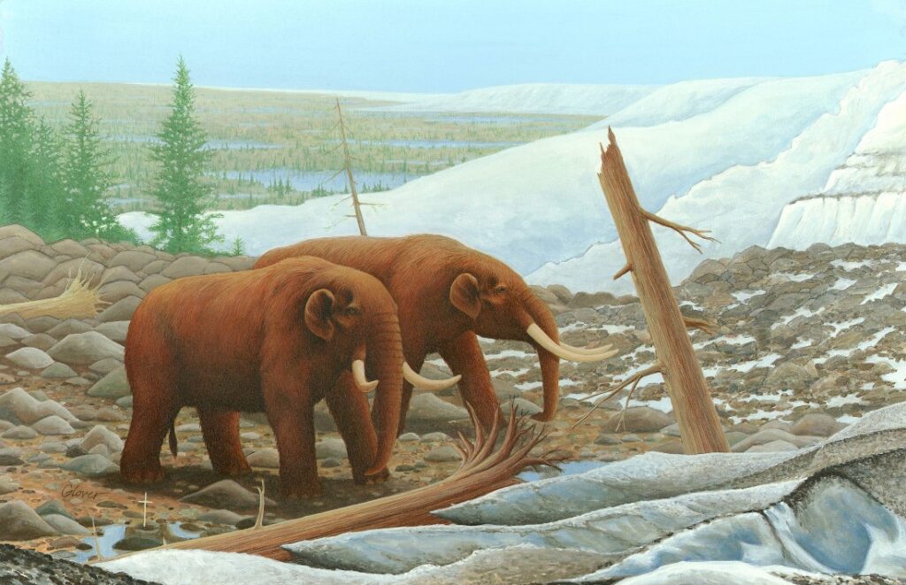 Mastodons walking near the front of a large glacier.