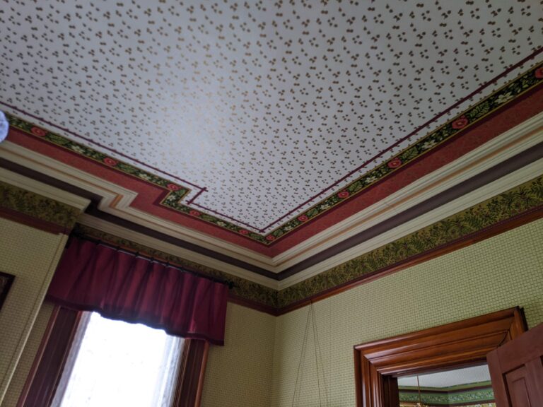 Many of the ceilings in the home are elaborately papered.