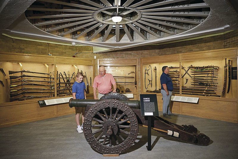 Visitors viewing the weapons collection at Hayes Presidential Library & Museums