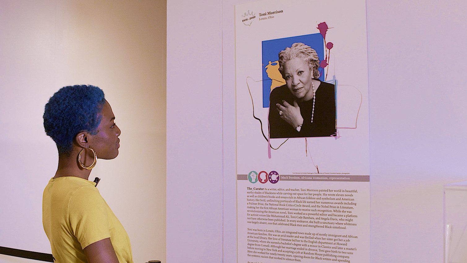 Visitor reading about Toni Morrison at National Afro-American Museum & Cultural Center