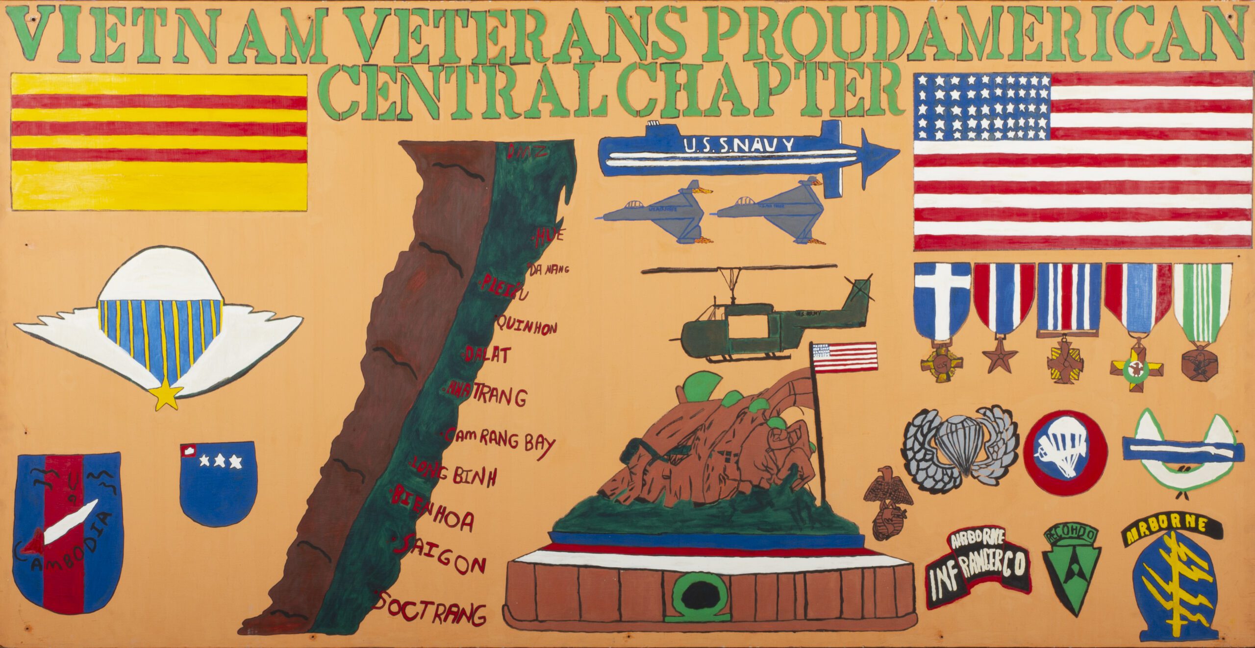 Acrylic painting on a plywood sheet was made in Columbus, Ohio, by Harry Edwards around 1981. The painting has a orange background. At the top in green is text 'VIETNAM VETERANS PROUD AMERICAN / CENTRAL CHAPTER." 