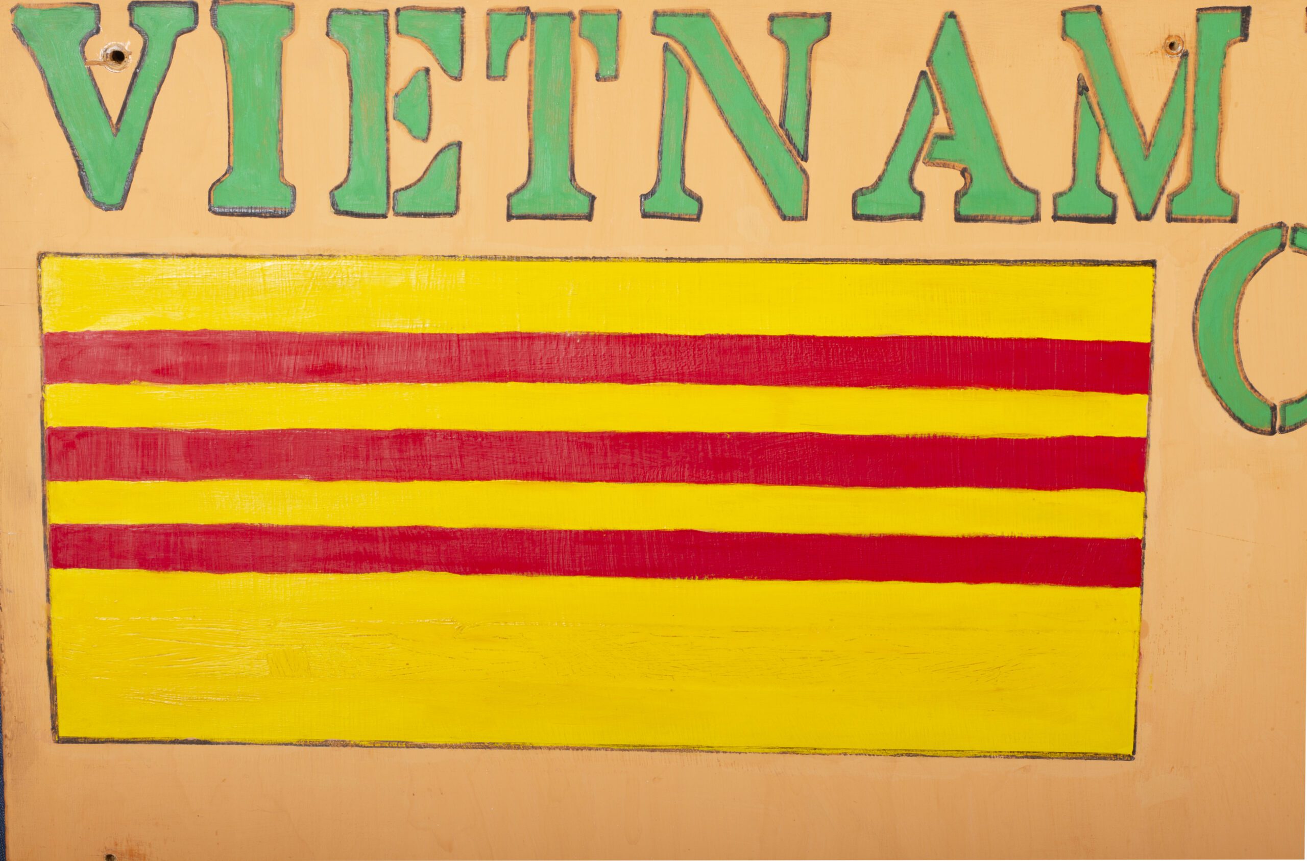 Detail of painting on plywood by Harry Edwards depicting "Vietnam" in green on a yellow background with the Vietnam flag beneath