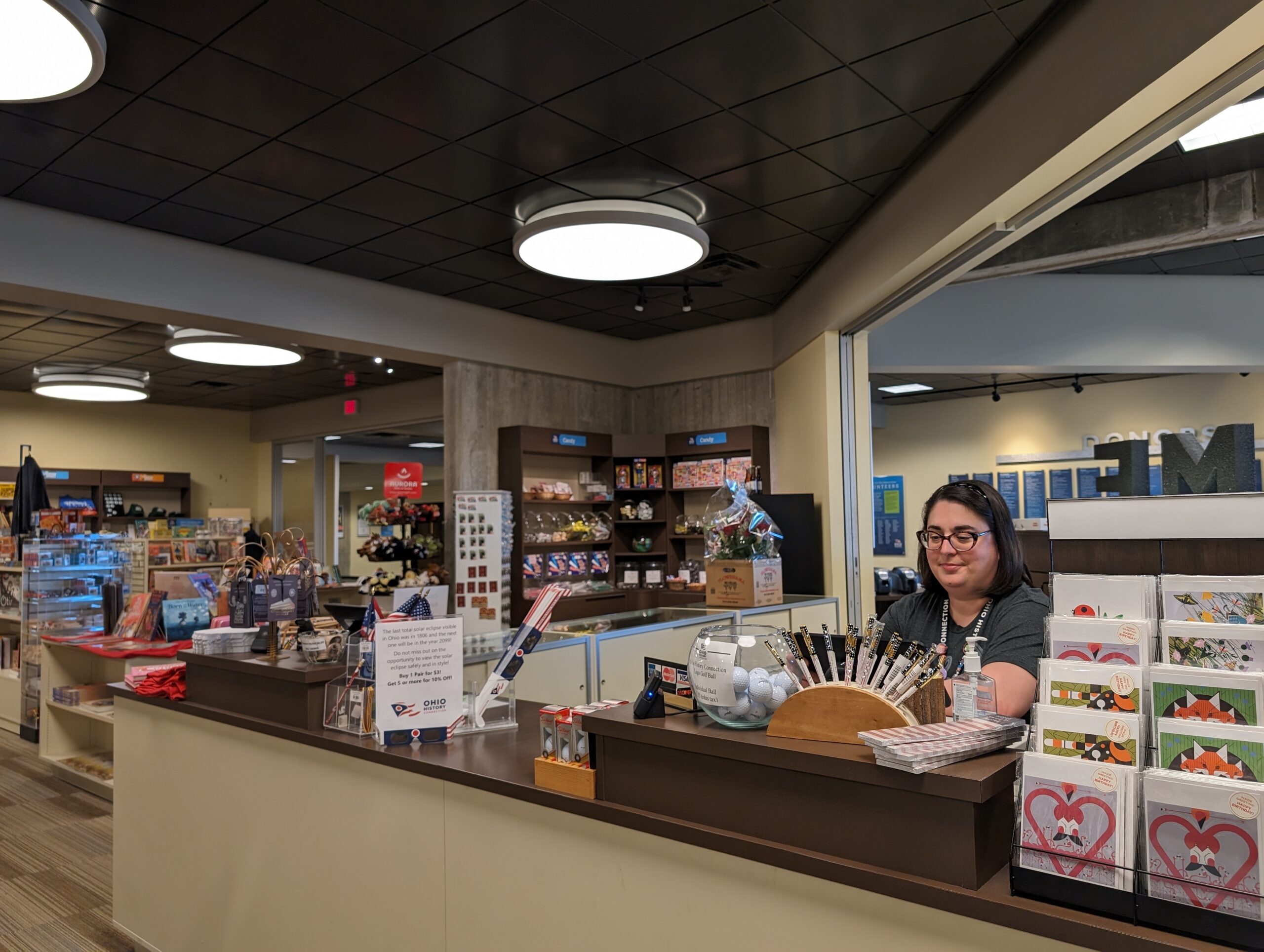 Store Associate at gift store counter.