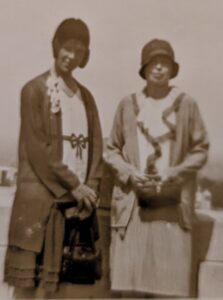 A sepia-toned image of two women.