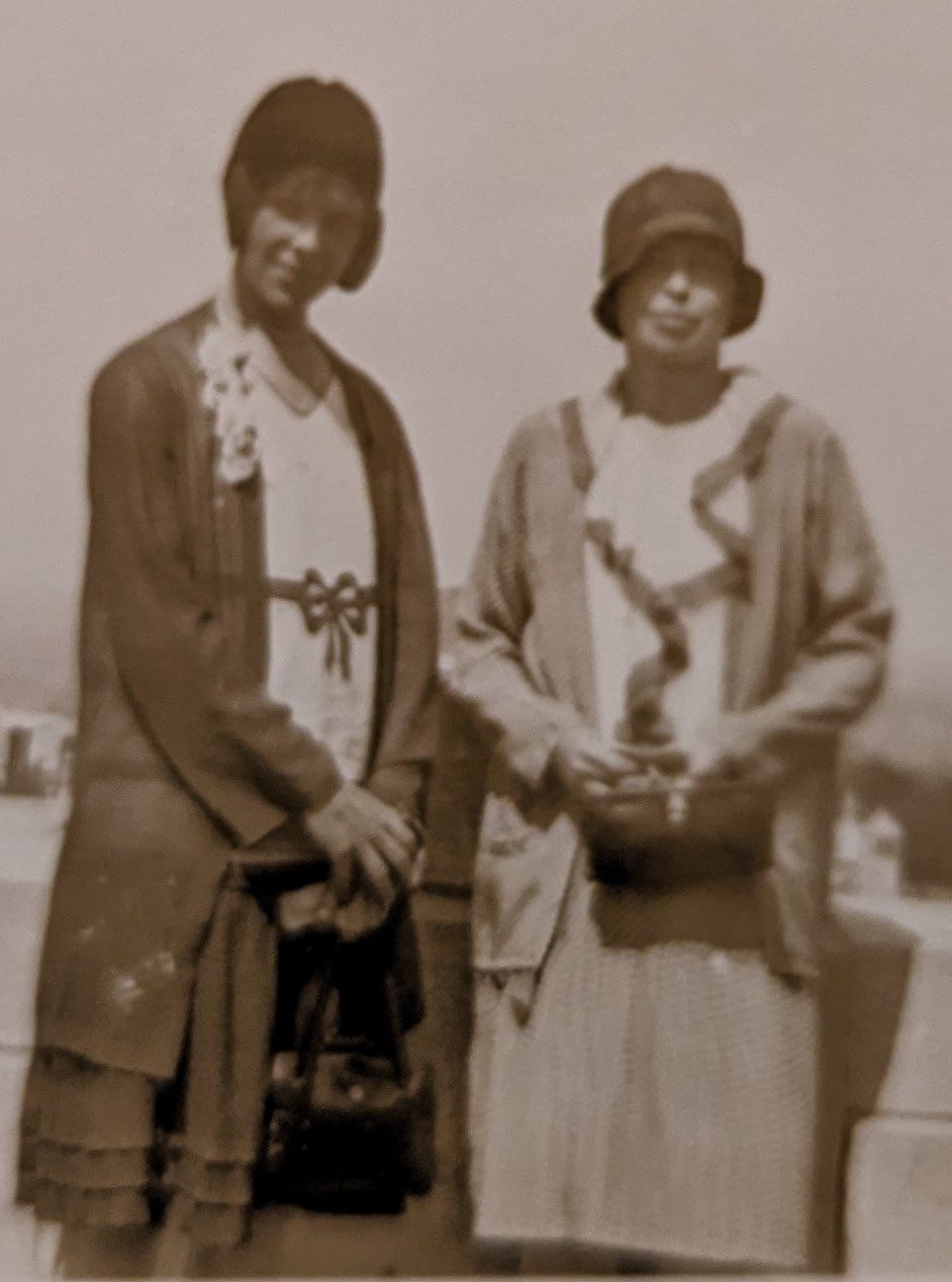 A sepia-toned photograph of two women.