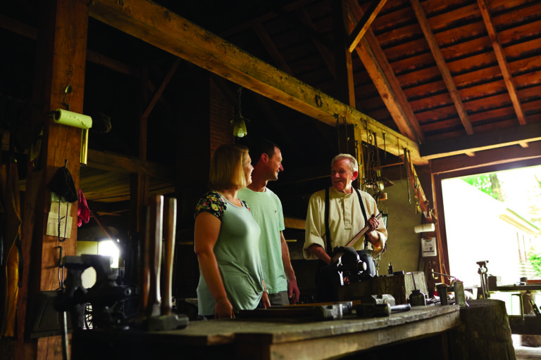 Image of visitors enjoying a blacksmith class at Zoar Village.