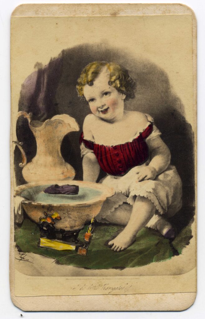 Colored image of a child sitting next to a wash basin and pitcher. The basin is filled with water, and toys in the water and next to the basin.