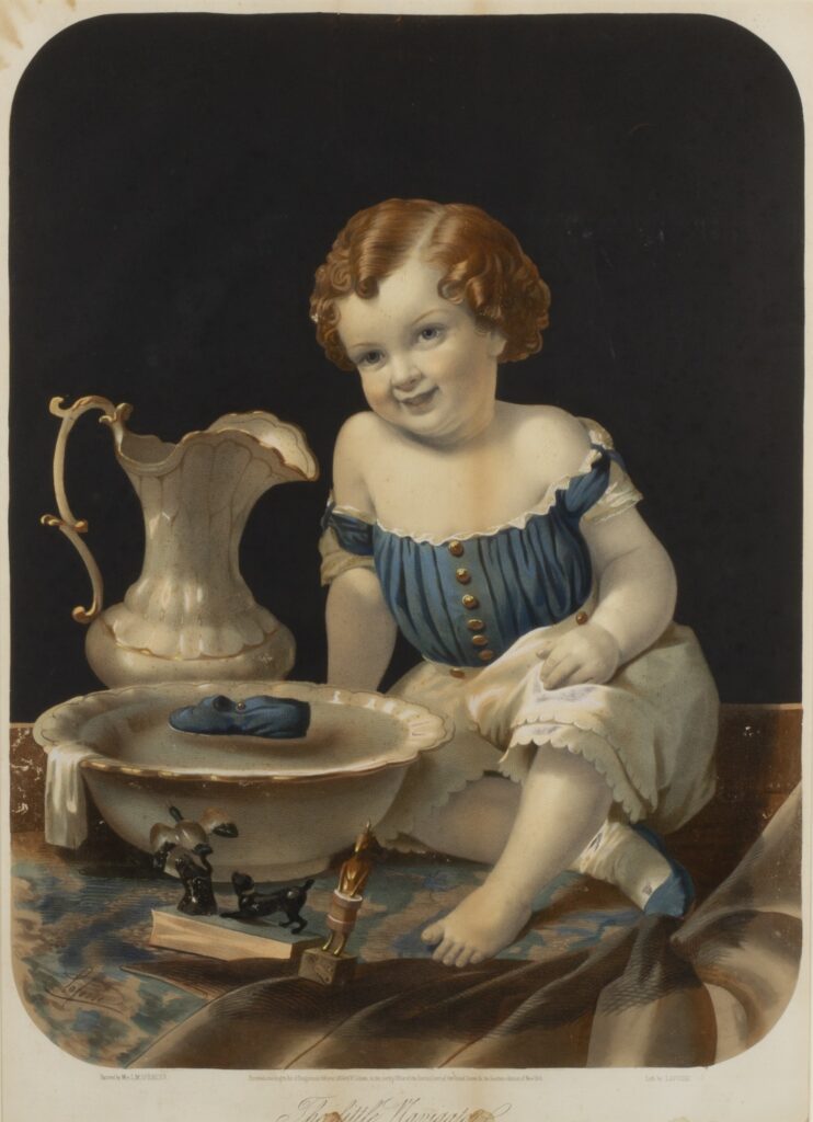 Colored print in a frame of a child sitting next to a wash basin and pitcher. The basin is filled with water, and toys in the water and next to the basin.