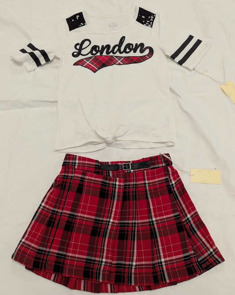 White T-shirt with London in black script and red and black plaid skirt