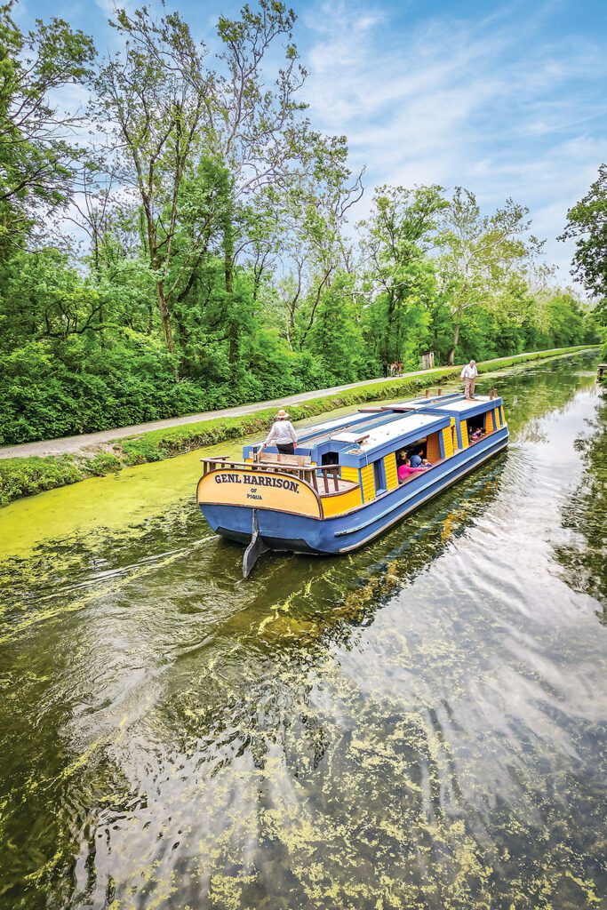Image of the General Harrison of Piqua, historic canal boat, on the water at Johnston Farm and Indian Agency.