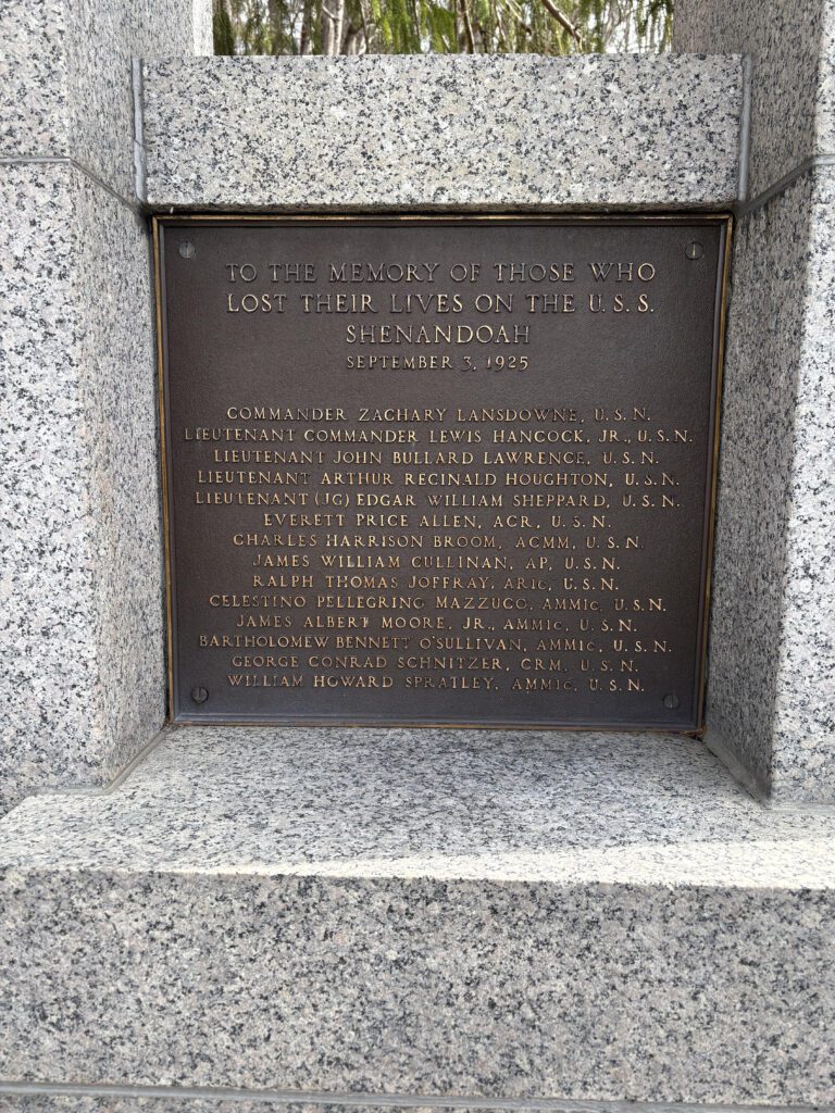 Bronze memorial plaque at the USS Shenandoah Memorial which reads: To the memory of those who lost their lives on the U.S.S. Shenandoah