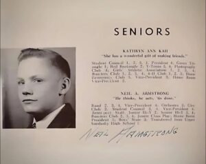 A photo of young Neil Armstrong during high school appears on the left. On the right is text that reads "Seniors" with information about two students. The first says "Kathryn Ann Kah 'She has a wonderful gift of making friends.' Student Council 1, 2, 3, 4; President 4; Green Triangle 1; Red Rectangle 2; Y-Tenne 3, 4; Photography Club 4; Girls' Athletic Association 1, 2, 3, 4; Boosteres Club 1, 2, 3 4; 4-H Clib 1, 2, 3; Home Economic Club 3. Vice President 3; Home Room Vice-President 3. Neil A. Armstrong 'He thinks, he acts, 'tis done.' Band 2, 3, 4, Vice-President 4; Orchestra 3; Glee Club 2; Student Council 3, 4; Vice-President 4; Retrospect Staff: Junior Hi-Y 2; Senior Hi-Y 3, 4; Boosters Club 2, 3, 4; Junior Class Play; Home Room President 3; Boys' State 3; Transferred from Upper Sandusky High School 1." Neil Armstrong is written by hand below this.