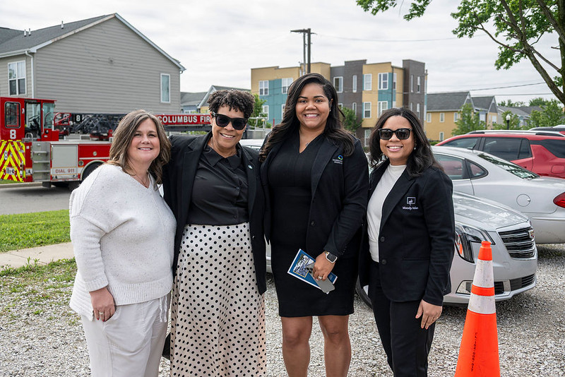 Guests smile for the camera before the start of the Poindexter Village African American Museum groundbreaking.