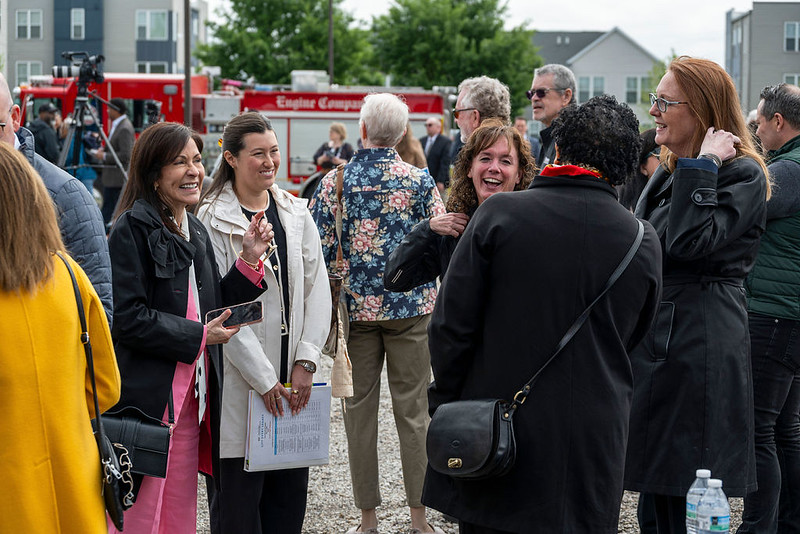 Visitors mingle before the groundbreaking of Poindexter Village African American Museum.