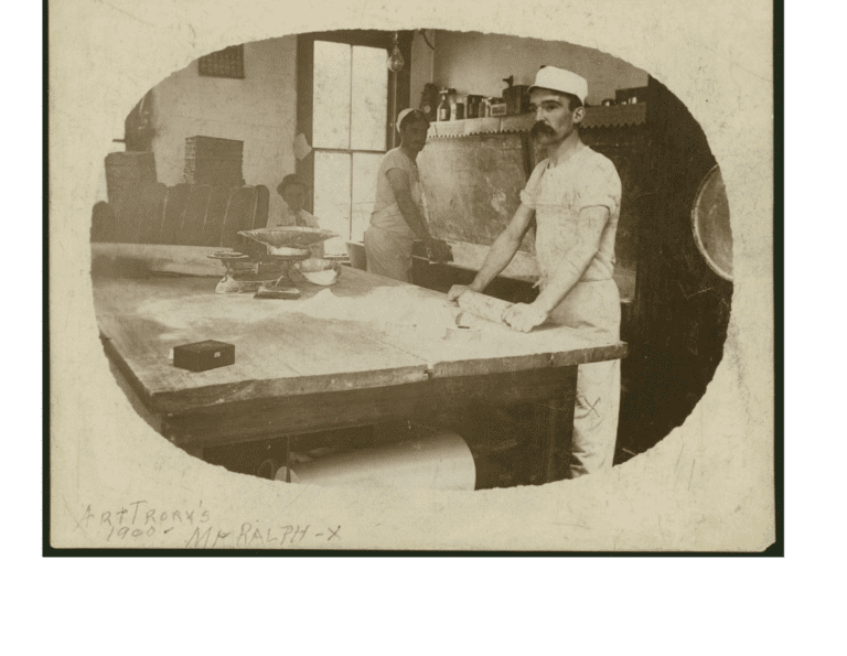 Black and white photograph of two bakers working in a kitchen