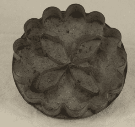Cookie cutter pressed and soldered from tin with a beveled edge, makes a four petal flower. 