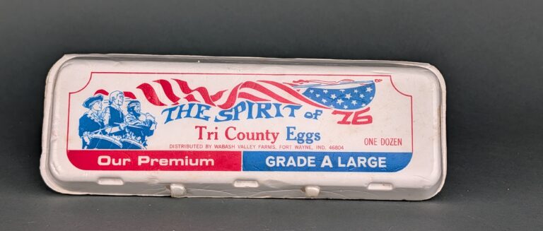 white Styrofoam egg carton with the Spirt of '76 printed across the top
