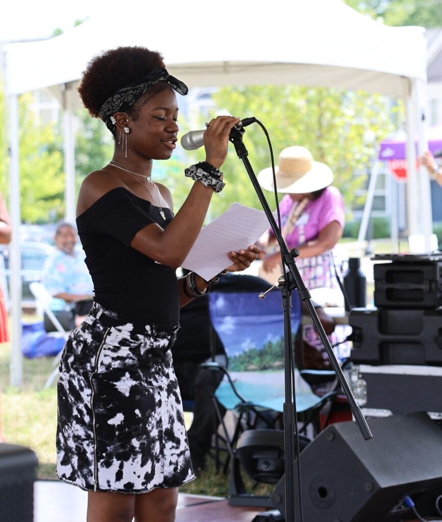 Afrofuturism Poetry Contest 1st Place Contest Winner, Dionna Kendrick, reads her work at the 2024 Poindexter Drum Circle.