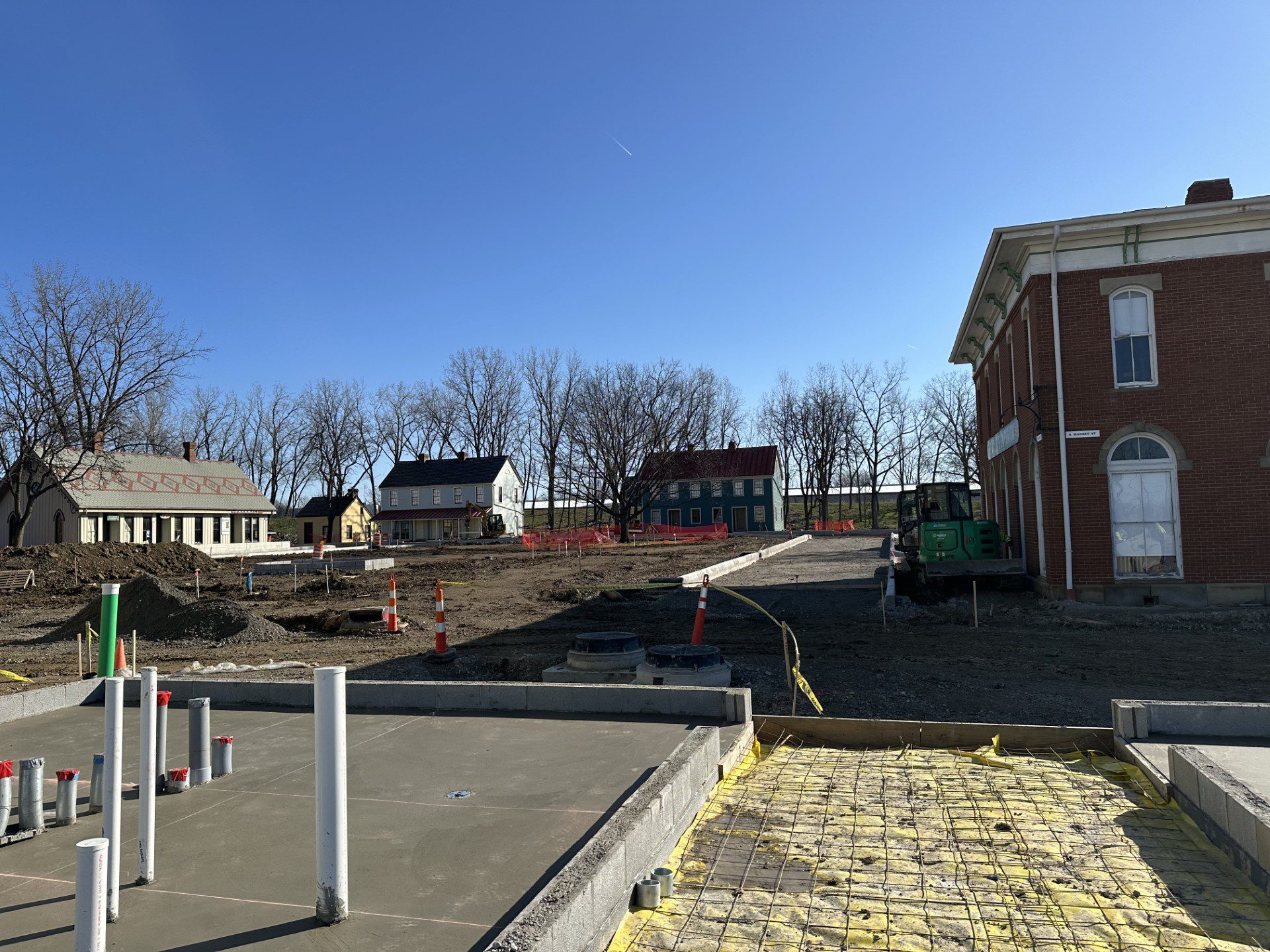 New Stable House Foundations have been poured while the square and Ohio Village buildings exist in the background.