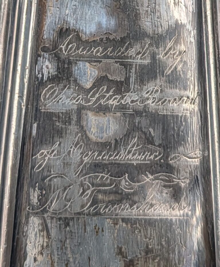 Detail of engraving on water pitcher, reads "Awarded by Ohio State Board of Agriculture. N.P. Townshend"