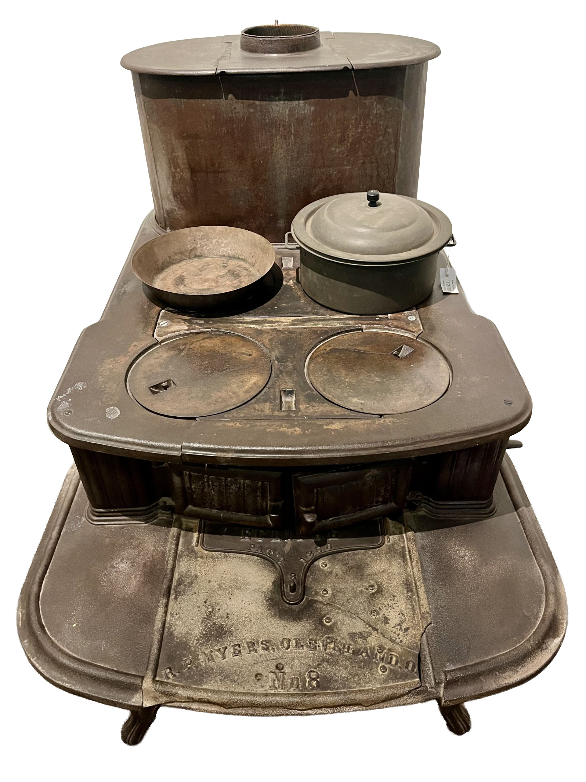 Photograph of an iron cookstove made by R. P. Myers in Cincinnati. The image has been edited to remove background elements.