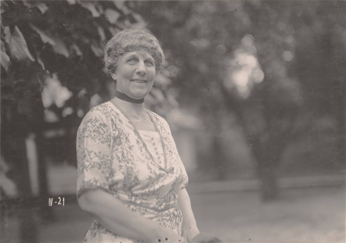 Dated 1920, this photograph shows Florence Kling Harding, wife of Warren G. Harding, standing outside their home in Marion, Ohio.