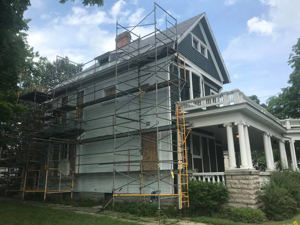 Image featuring scaffolding on the left side of the Harding Home as work begins on the siding, circa 2019.
