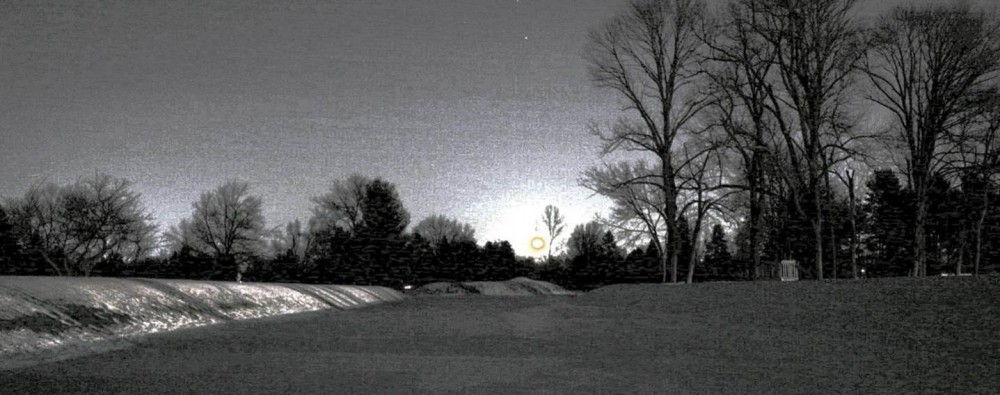 Moonrise on December 16, 2005 viewed from the entrance to the parallel-walled passageway leading into Newark's Octagon. The Moon is rising at just about its northernmost point on the eastern horizon in almost perfect alignment with the axis of the earthwork. (The absolute northernmost rise of the Moon took place in September of 2006.) Photograph by Michael Mickelson.