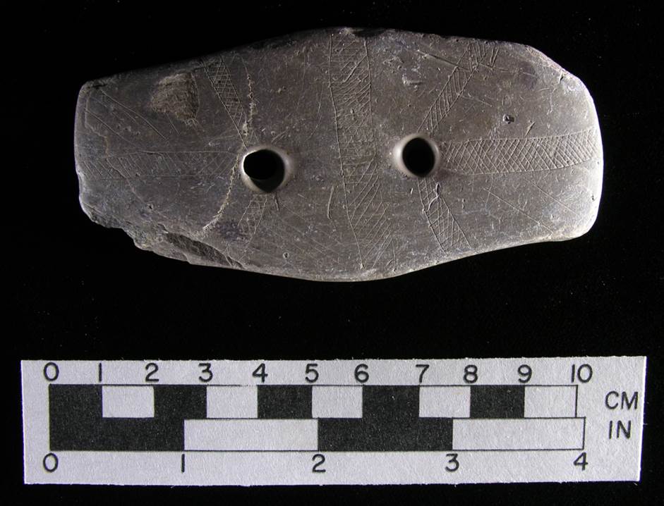 One of the most interesting artifacts in the collection is this rectangular, two-holed gorget with delicate geometric designs engraved upon it. It dates to somewhere between the Late Archaic and late Middle Woodland periods.